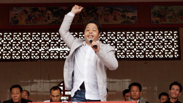 Zhuang Liehong makes his point forcefully at this week's rally in Wukan to introduce candidates to voters.