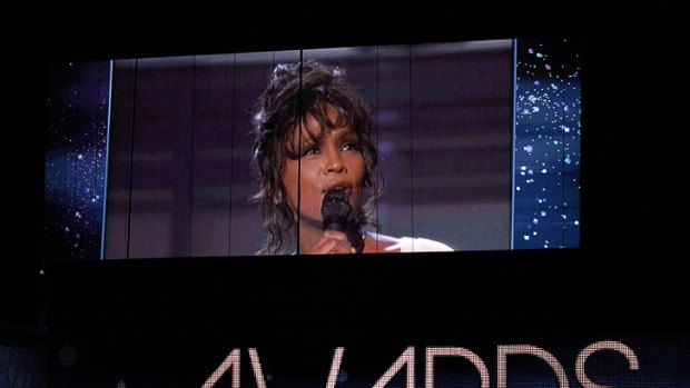 A performance by Whitney Houston at the 1994 Grammys is played on a screen at this year's awards.