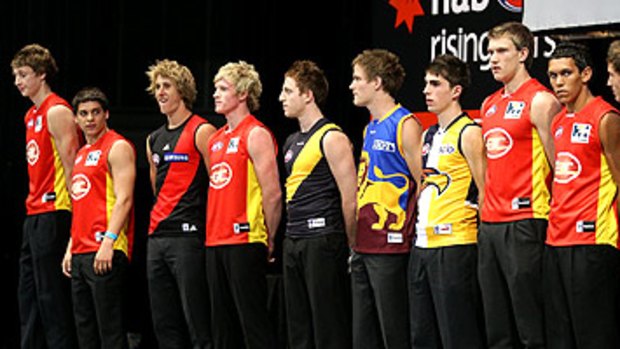 Ten of the best: the top 10 picks of the 2010 AFL draft parade in their new colours on the Gold Coast yesterday.