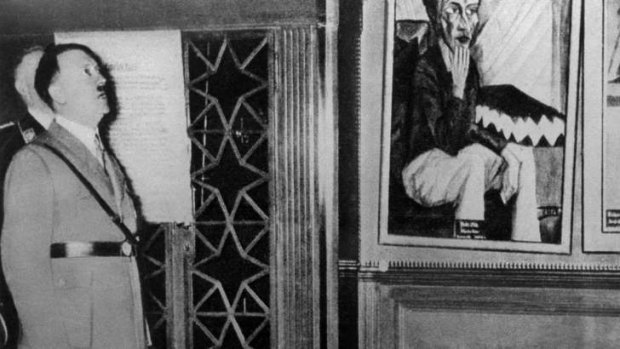 Adolf Hitler looks at works of art at the"Schreckenskammer" ("chamber of horrors"), a forerunner of the great travelling exhibition "Entartete Kunst" ("Degenerated Art") in Dresden August 17, 1935. Photo: Reuters