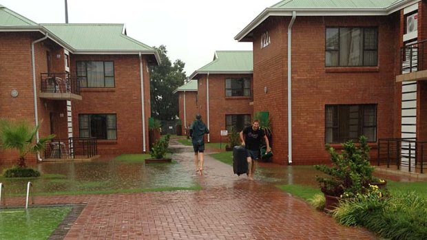 Paceman Ryan Harris (right) was among those forced to go barefoot as rain swamped the players' hotel and training venue in Potchefstroom.
