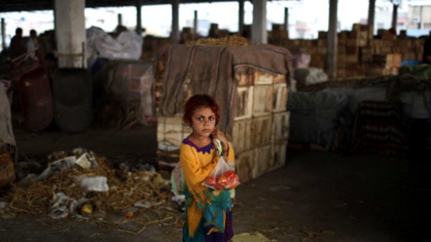 Vulnerability... a girl in an Islamabad market two days after the suicide attack on the city's World Food Program office that killed five aid workers.