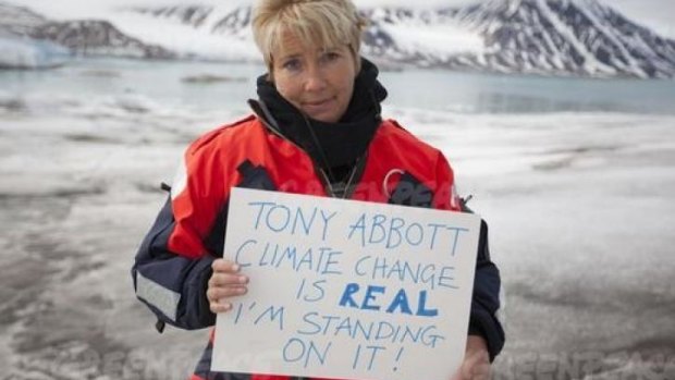 Emma Thompson calls out to Tony Abbott from the top of the Arctic glacier Smeerenburg.