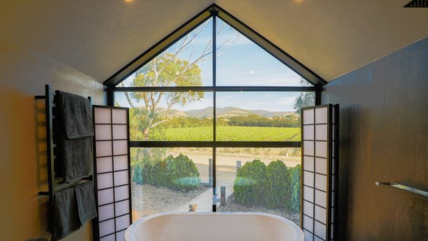 The bathroom overlooking organic shiraz vineyards at Old Chaff Mill Retreat.