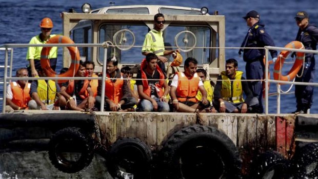 Asylum seekers being transferred to Christmas Island.