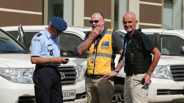 Brian McDonald (centre) of the Australian Federal Police contingent with a Dutch colleague (left) and OSCE member (right) in Donetsk.