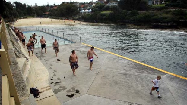 Calm before the storm . . . Sydney Roosters players in recovery mode at Clovelly Beach yesterday.