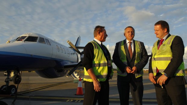 Brindabella Airlines absorbed Newcastle-based Aeropelican in June. Pictured are Aeropelican's chief pilot Steve O'Dwyer, Brindabella's CEO Paul Schutz, and Brindabella's chief commercial officer James Blake.