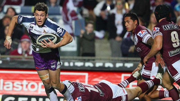 Last grasp: Storm's Rory Kostjasyn stopped in the tight encounter with the Sea Eagles.