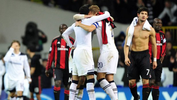 Tottenham players celebrate their win while AC Milan's Alexandre Pato shows his disappointment.