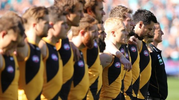 Richmond players line up for the national anthem before the elimination final on Sunday.