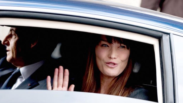 Carla Bruni waves to supporters.
