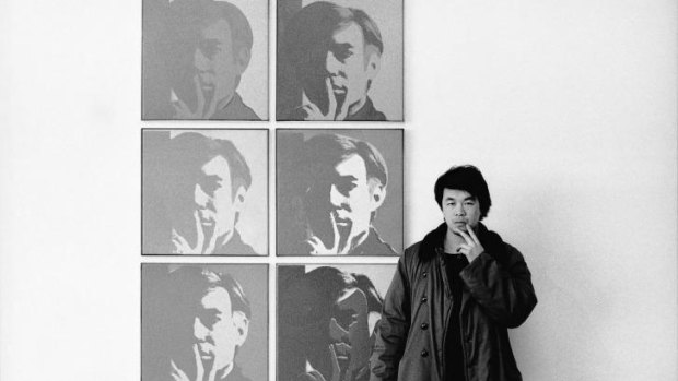 Ai Weiwei poses in front of a Warhol work at New York's Museum of Modern Art in 1987.