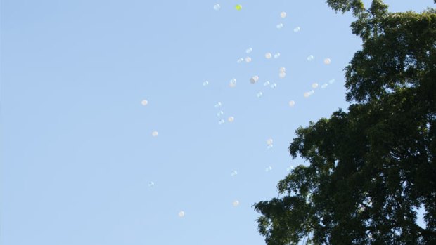 Balloons are released in honour of Sidonie Thompson.