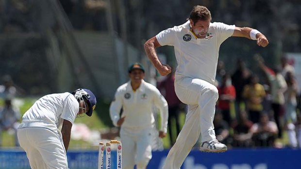 Got him: Australia's Ryan Harris shows his elation after taking the wicket of Mahela Jayawardene.