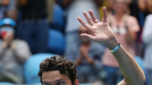 Milos Raonic celebrates after winning match point against Marin Cilic.