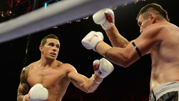Points decision ... Sonny Bill Williams faces Scott Lewis last night at Gold Coast Convention Centre.