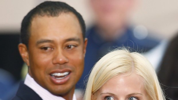 'Infidelity bill' ... Tiger Woods pictured with wife Elin Nordegren in October.