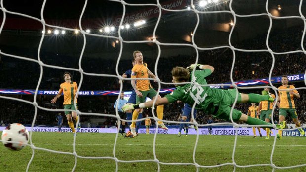 On target: France's forward Olivier Giroud (second left) scores past Australia's goalkeeper Mitchell Langerak.