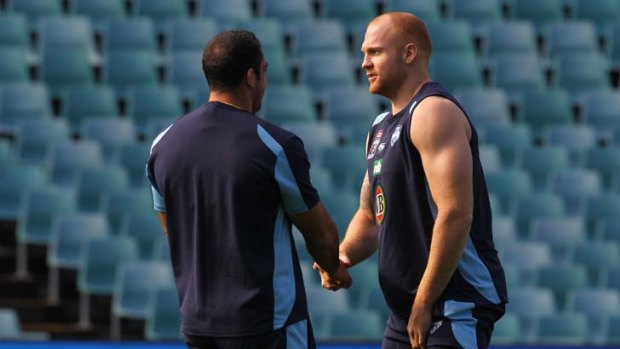 Galloway with Tim Mannah at Blues training yesterday.