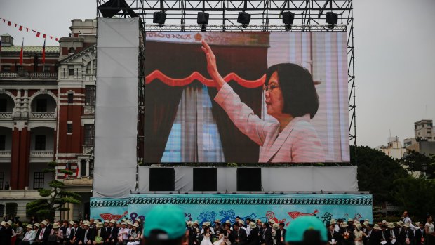 Taiwan's incoming president Tsai Ing-wen is seen on a screen as she is sworn in on Friday.