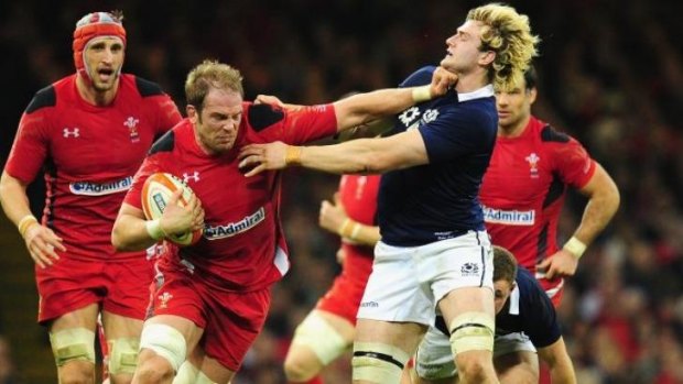 At arm's length: Alun Wyn Jones of Wales palms of Richie Gray of Scotland.