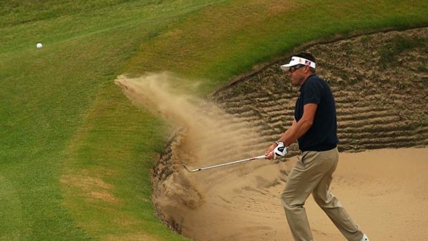 Open range: Robert Allenby plays from the bunker during his second round of practice at Royal St George's.