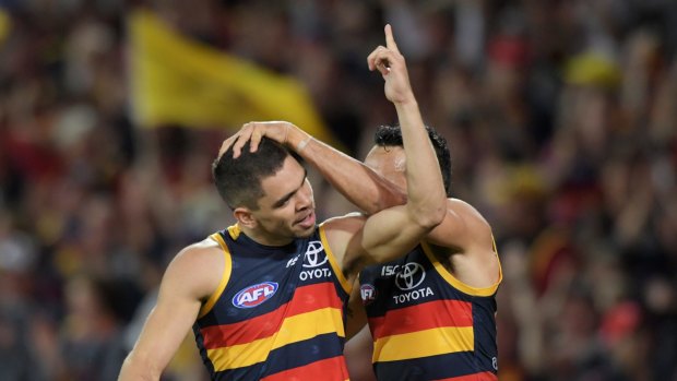 Charlie Cameron of the Crows celebrates a goal with Eddie Betts. Photo: AAP