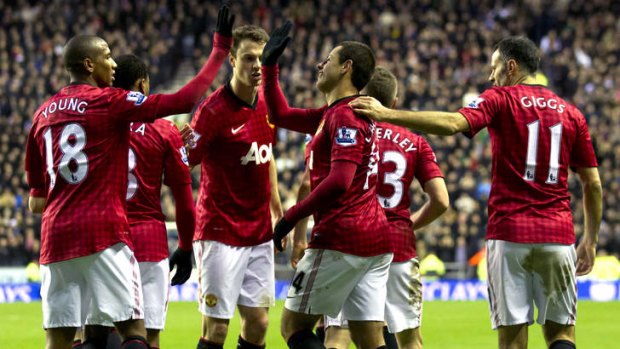 Manchester United's Javier Hernandez (second right) celebrates with teammates after scoring his second goal against Wigan Athletic.