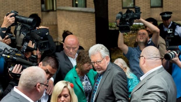 Rolf Harris leaves court after being found guilty of 12 indecent assault charges.