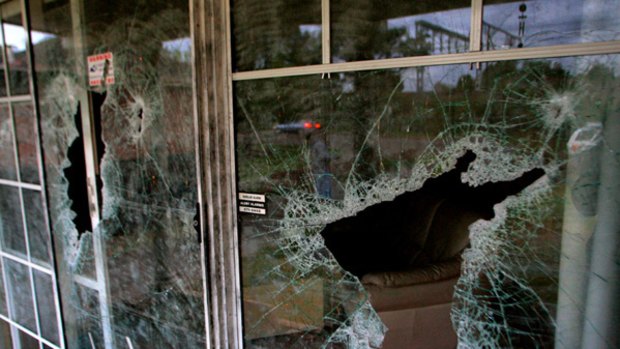 Broken windows at the house that was attacked in Westmead.