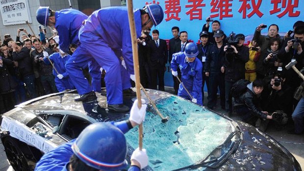 Sledgehammers were used to destroy a $650,000 lamborghini Gallardo in China.