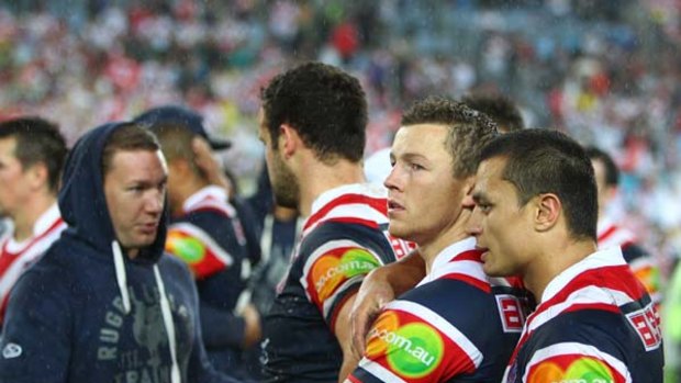 Hurting . . . Roosters players ponder what might have been.