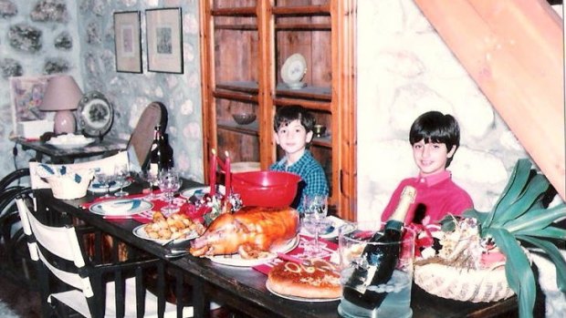 A young Spyros Vrakas (in red) enjoys Christmas in Greece.