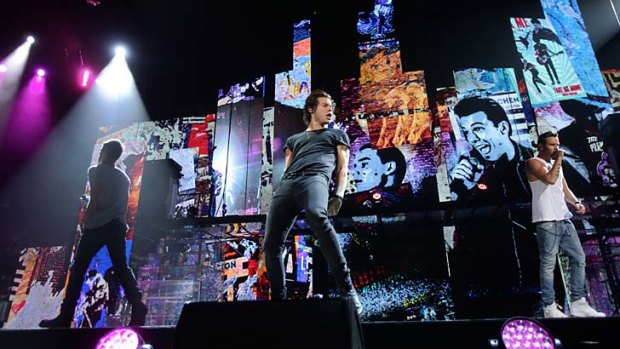 Footloose and fancy free: One Direction show off improved singing and dancing since their visit to Australia last year.