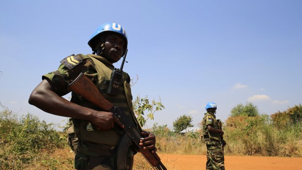 Volatile situation ... United Nations Mission in Sudan (UNAMIS) personnel guard South Sudanese people displaced by recent fighting in Jabel, on the outskirts of capital Juba.