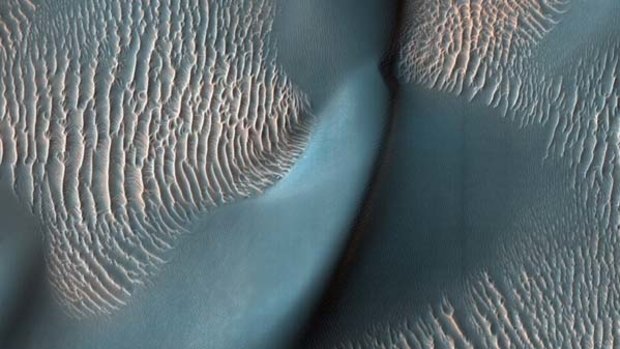 Mysterious dark sand dunes around Mars's northern polar cap are shifting with the seasons.