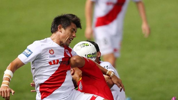 Knees-up: Heart's Jonatan Germano raises the stakes against Adelaide on Friday night.