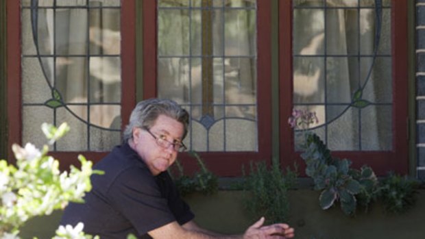 Protected... Andrew Lambert at his home this week, where he remains on a base salary of $52, 000, thanks to a tribunal decision, despite being sacked for abusing vulnerable people in his care.