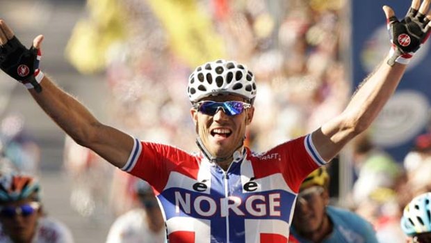 The Gold of Thunder . . Thor Hushovd celebrates as he crosses the finish line.