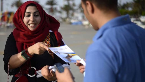 Voices heard &#8230; a Justice and Construction party supporter distributes leaflets.