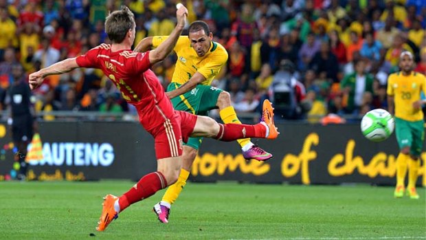 South Africa Midfielder Daylon Claasen (R) vies with Spain's Defender Nacho Monreal.