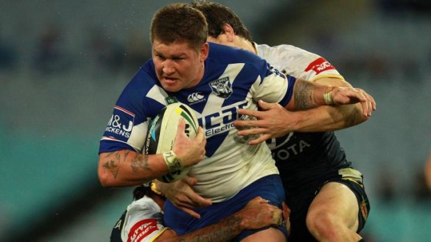 Roped in: The Cowboys bring Bulldogs forward Greg Eastwood down.