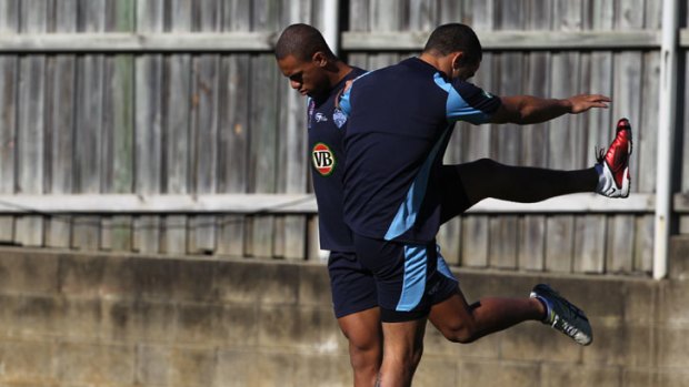 Latter day hero ... Will Hopoate works out with Jarryd Hayne during Blues training at Coogee Oval yesterday.
