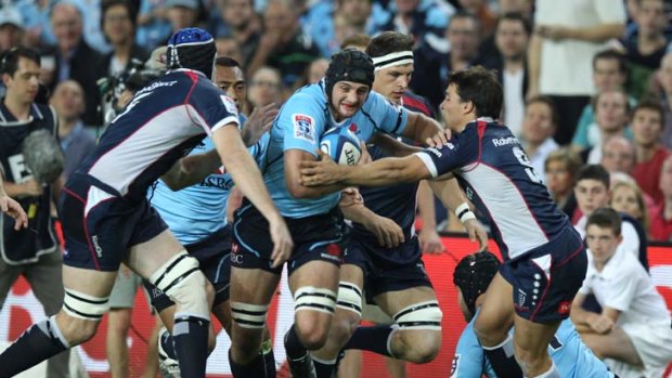 On the charge &#8230; Exeter-bound Dean Mumm in action for the Waratahs last night.