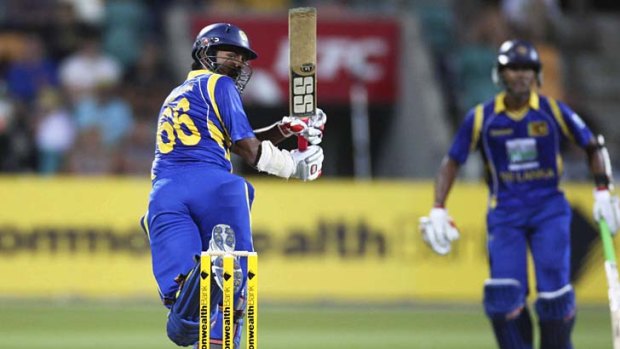 Lahiru Thirmanne flips up a deliver from Daniel Christian that was caught by Ben Hilfenhaus.