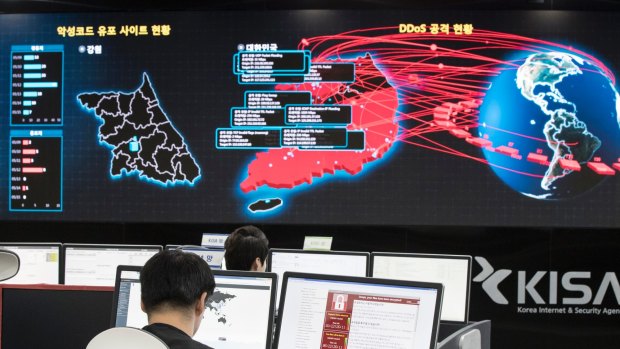 Employees watch electronic boards to monitor possible ransomware cyberattacks at the Korea Internet and Security Agency in Seoul, South Korea.