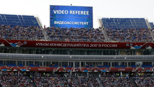 Break in play: A giant screen reports an incident is being investigated by VAR during the 2017 Confederations Cup.