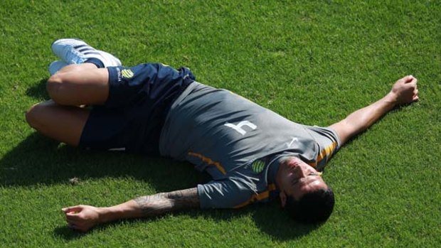 Tim Cahill stretches during a training session this week.