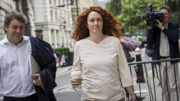 Cleared: Rebekah Brooks and her husband Charlie Brooks arrive at court in London.